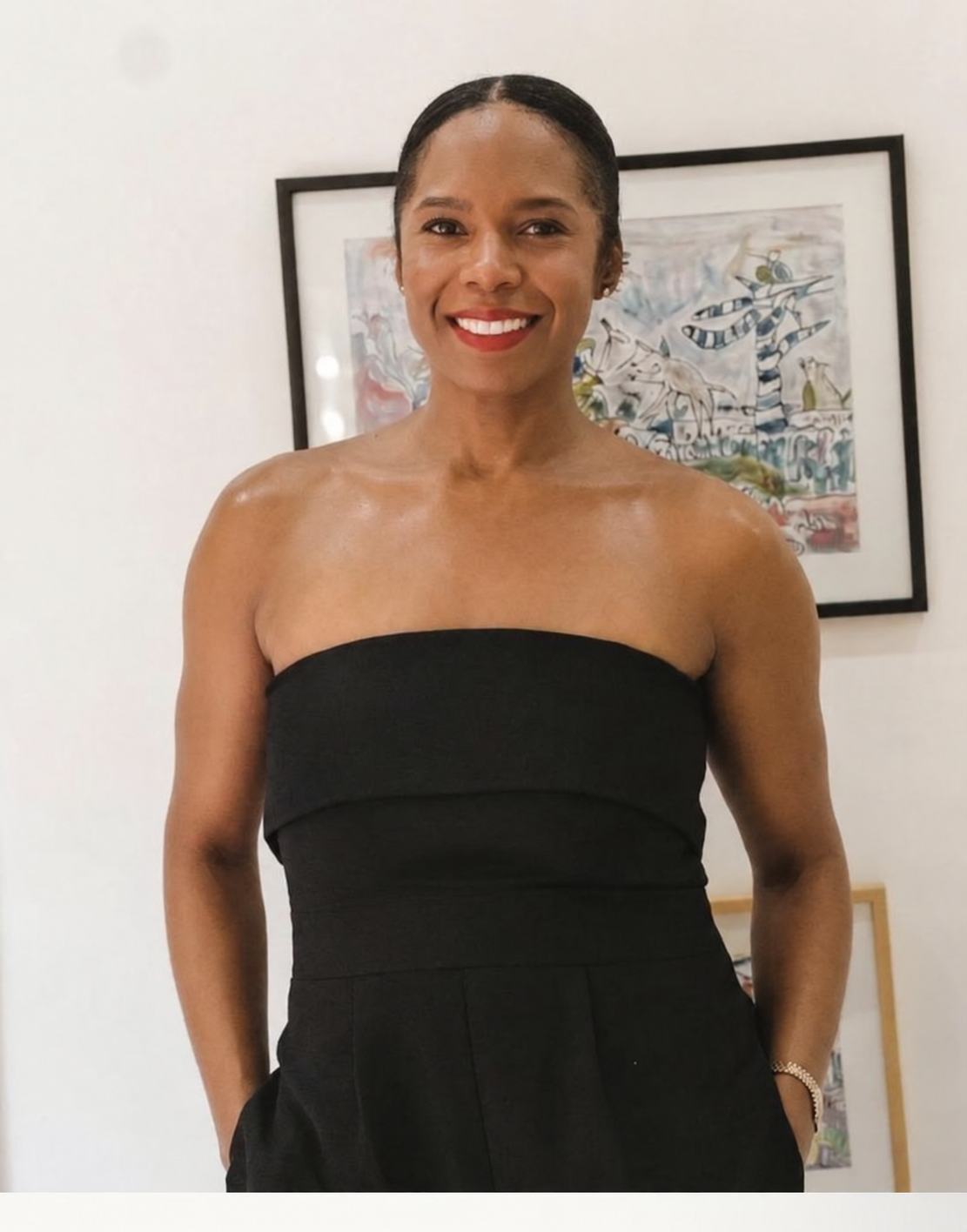 Ayofemi Kirby standing in front of artworks